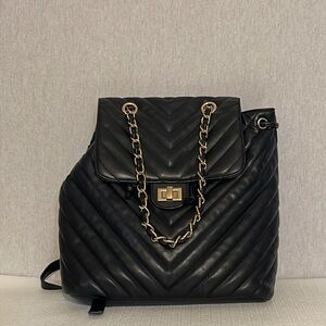 No brand, quilted, backpack/ hand bag.